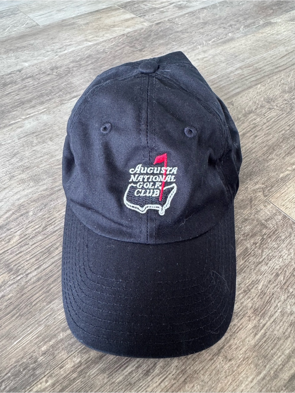 American Needle Black Baseball Cap with Red and White Embroidery